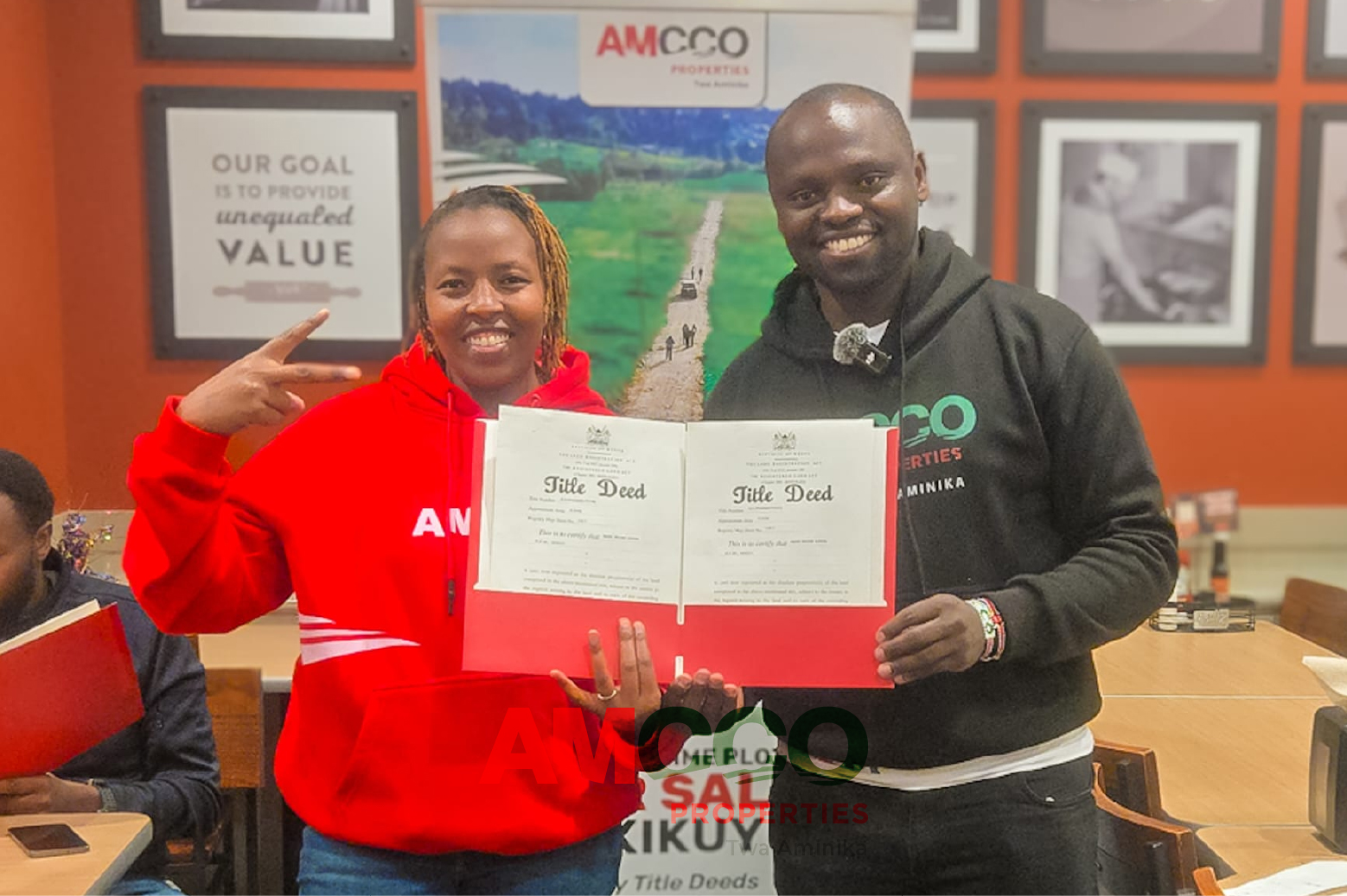 Happy AMCCO Diaspora Client Another Satisfied client with her title Deed hand delivered by AMCCO