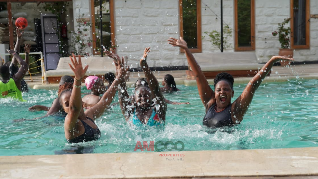 Team enjoying the swimming pool at the Amcco Team retreat